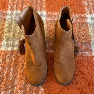 Brown suede booties with tassel zipper. Brand: Spirit. Heel: 3.5in. Size: 6.5.